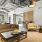 Clubroom with natural light, featuring comfortable seating, modern decor, and large windows