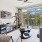Living room with a door leading to a balcony, featuring modern furnishings and decor