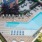 Aerial view of a pool at Vista Wilde Lake, showcasing the surrounding landscape and pool area