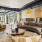 Clubroom with natural lighting, featuring comfortable seating, modern decor, and large windows